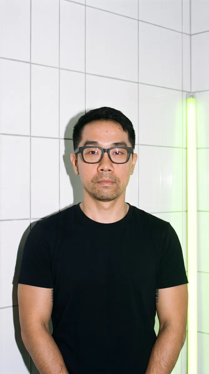 Ly in a white-tiled lab